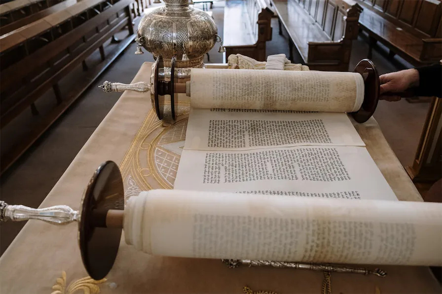 Open Torah scroll inside a synagogue during a Jewish heritage tour in Spain.